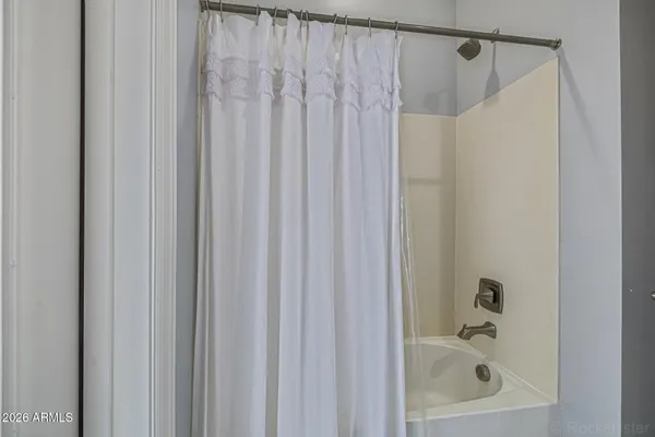 a kitchen with stainless steel appliances kitchen island granite countertop a stove a sink and a refrigerator