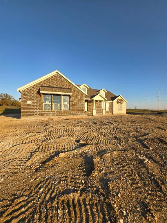 111 Hillview Trail Decatur, TX 76234 - Photo 2 of 20 a front view of a house with a yard