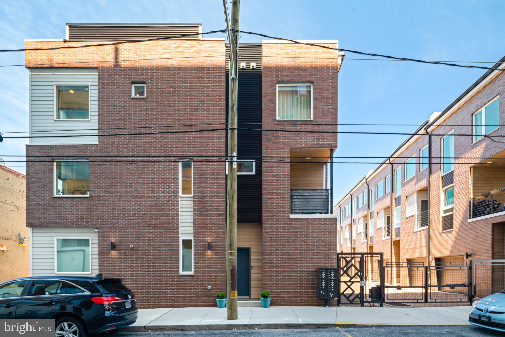159 East Allen Street, Unit 1 Philadelphia, PA 19125 - Photo 4 of 45 a front view of a house with a yard