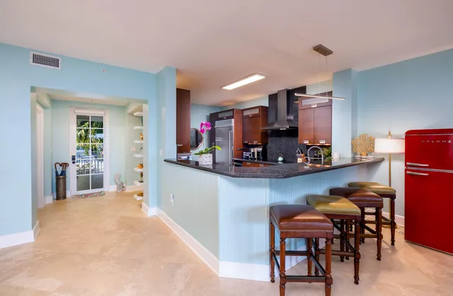 a view of a workspace with a table and chair in a room