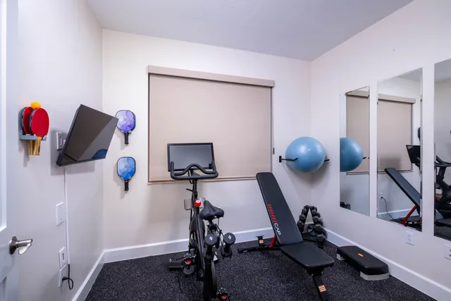 a view of a house with a garden and lake view