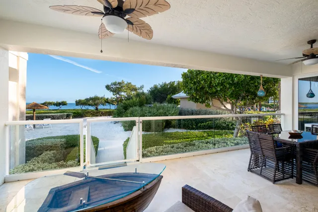 a living room with furniture pool table and a flat screen tv