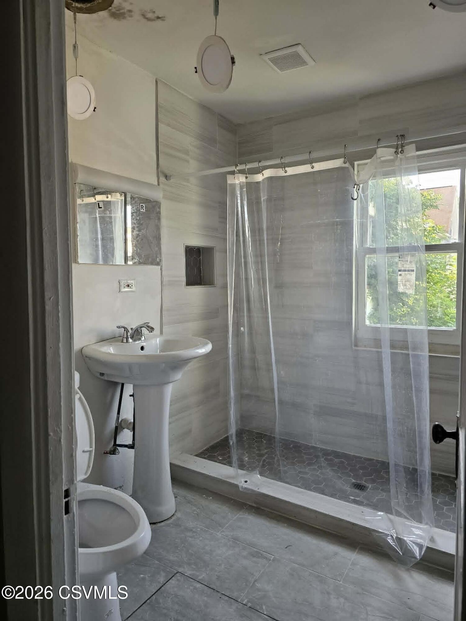 110 Birch Street Shamokin, PA 17872 - Photo 19 of 19 a bathroom with a sink toilet and shower
