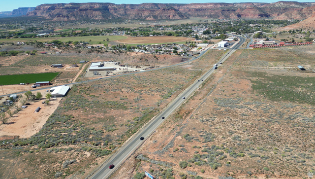 Undisclosed Address Kanab, UT 84741 - Photo 4 of 6 Aerial view of property's location featuring a mountain backdrop and rural landscape