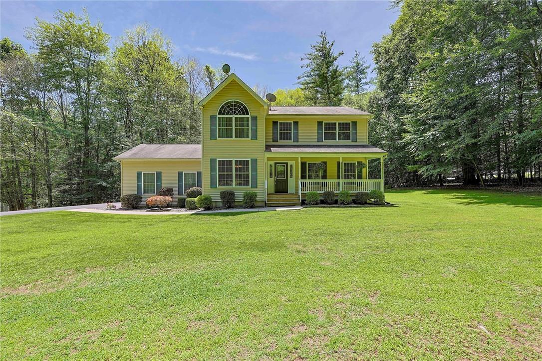 56 Roe Road Bloomingburg, NY 12721 - Photo 1 of 1 Colonial house featuring a porch and a front yard