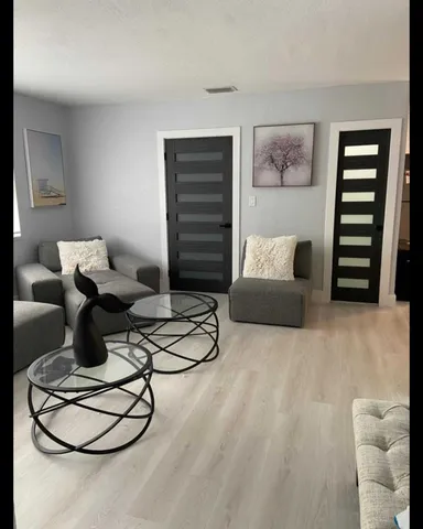 a living room with furniture and a couch