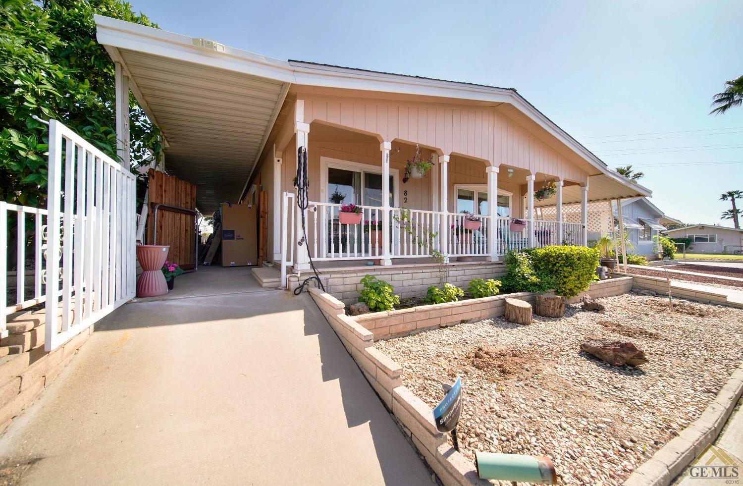 Undisclosed Address Bakersfield, CA 93308 - Photo 2 of 25 a view of a house with backyard and porch