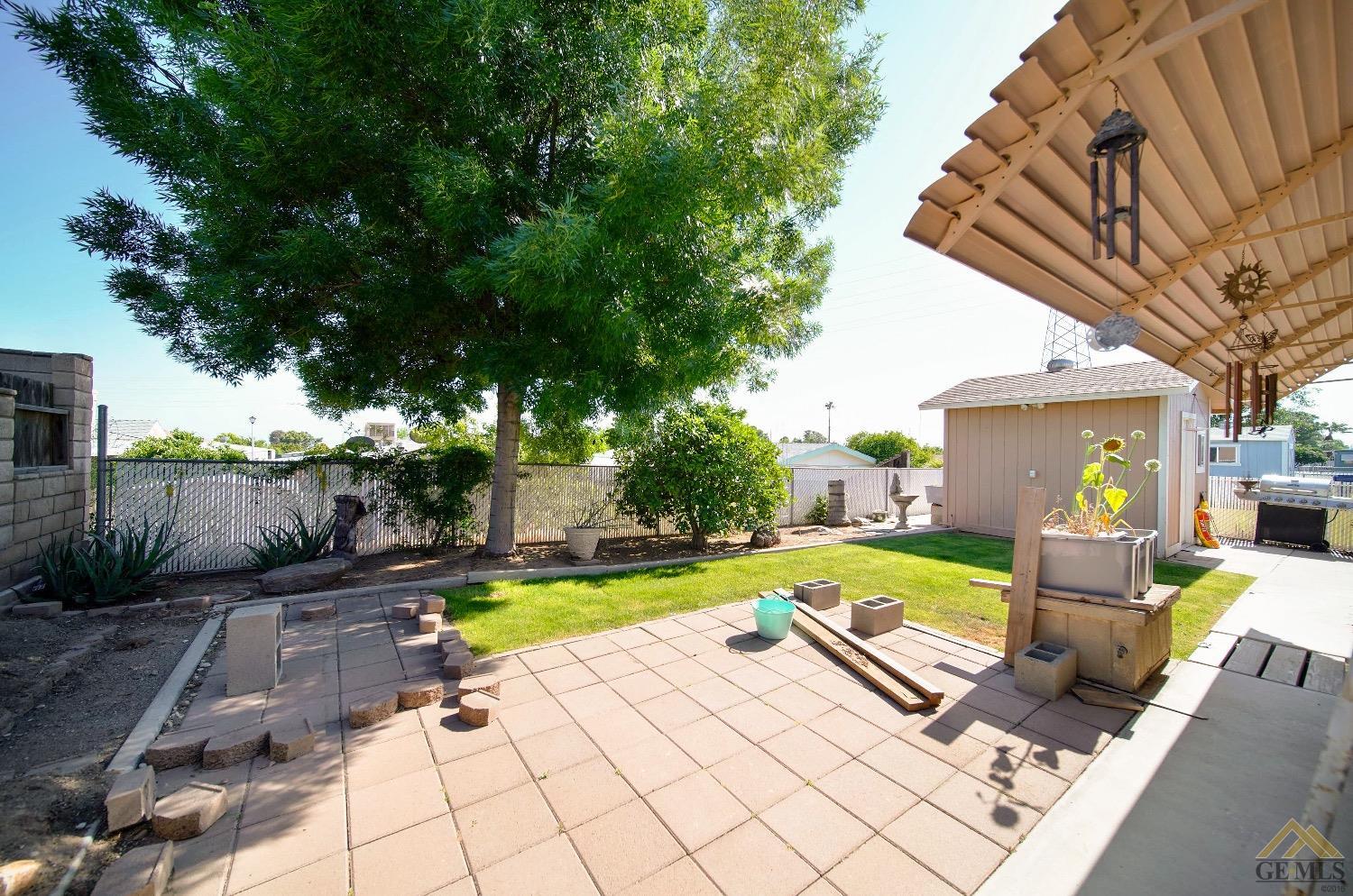 Undisclosed Address Bakersfield, CA 93308 - Photo 23 of 25 a view of a backyard with plants and patio