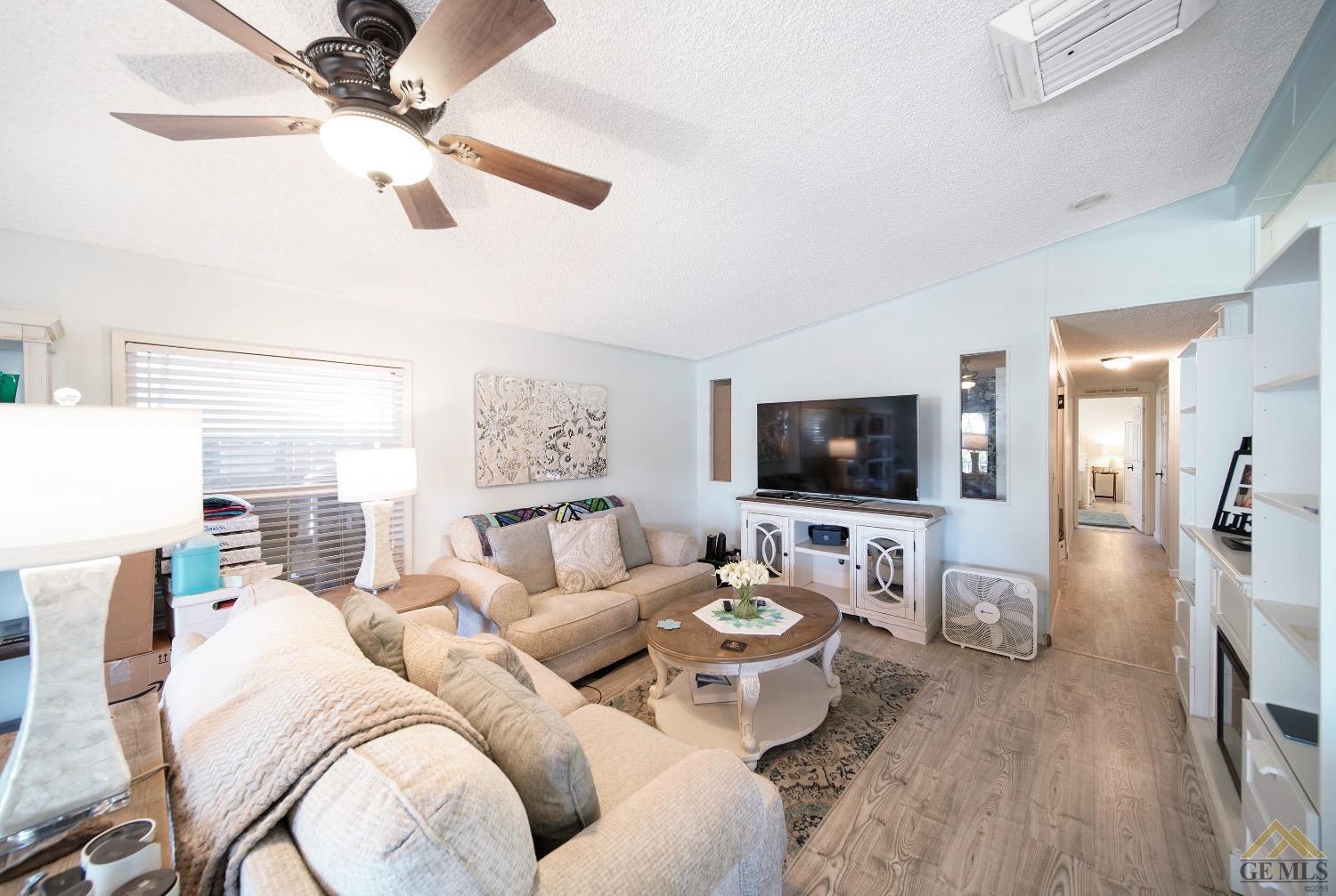 Undisclosed Address Bakersfield, CA 93308 - Photo 6 of 25 a living room with furniture and a flat screen tv