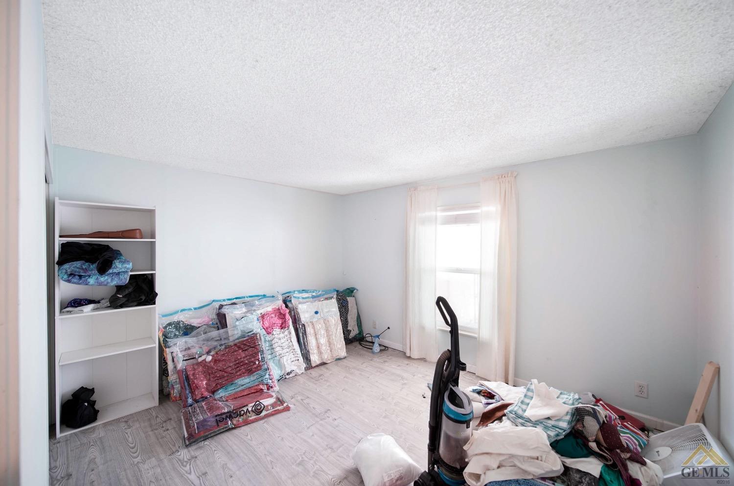 Undisclosed Address Bakersfield, CA 93308 - Photo 8 of 25 a room with a bed and a window