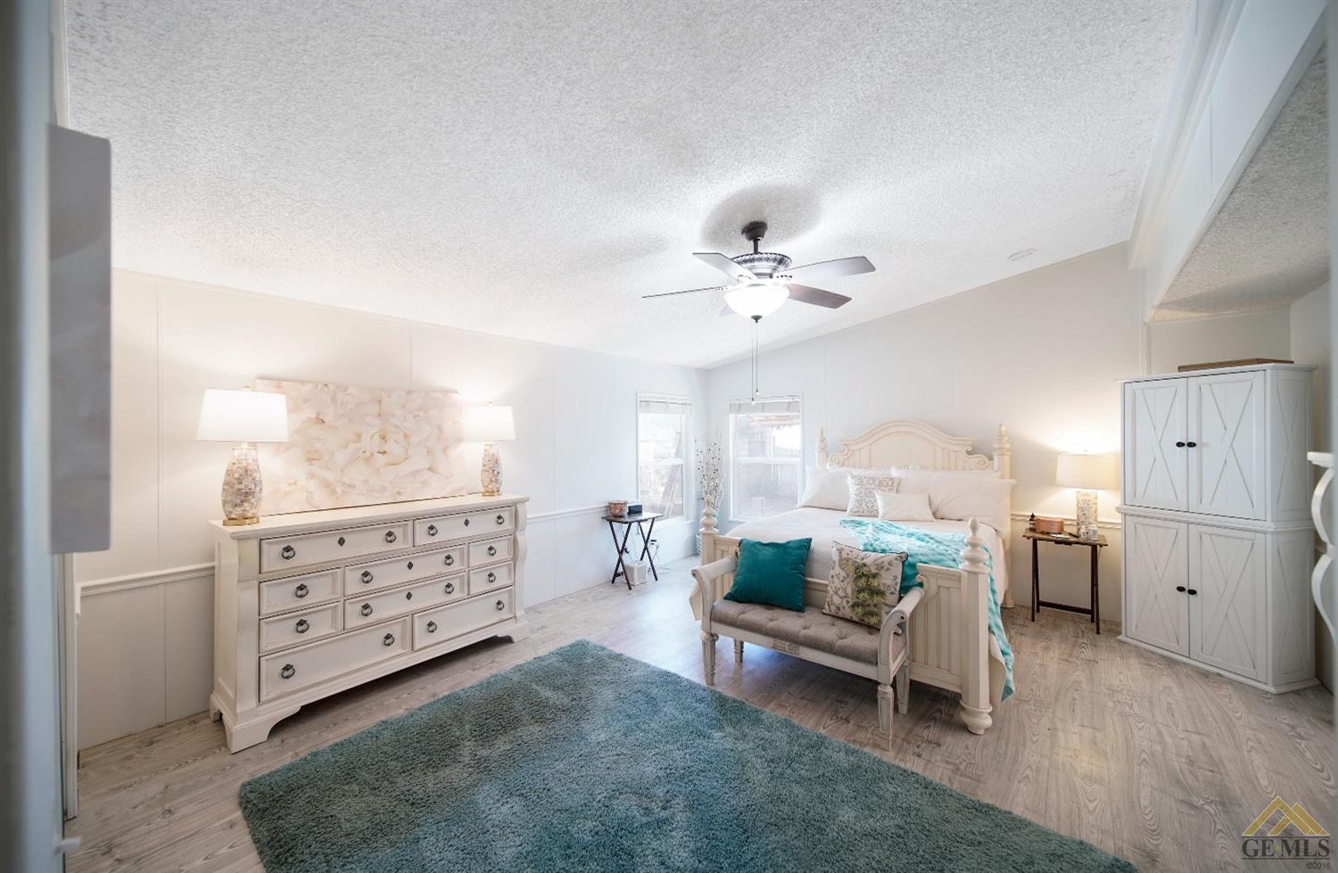 Undisclosed Address Bakersfield, CA 93308 - Photo 9 of 25 a living room with furniture and view of closet