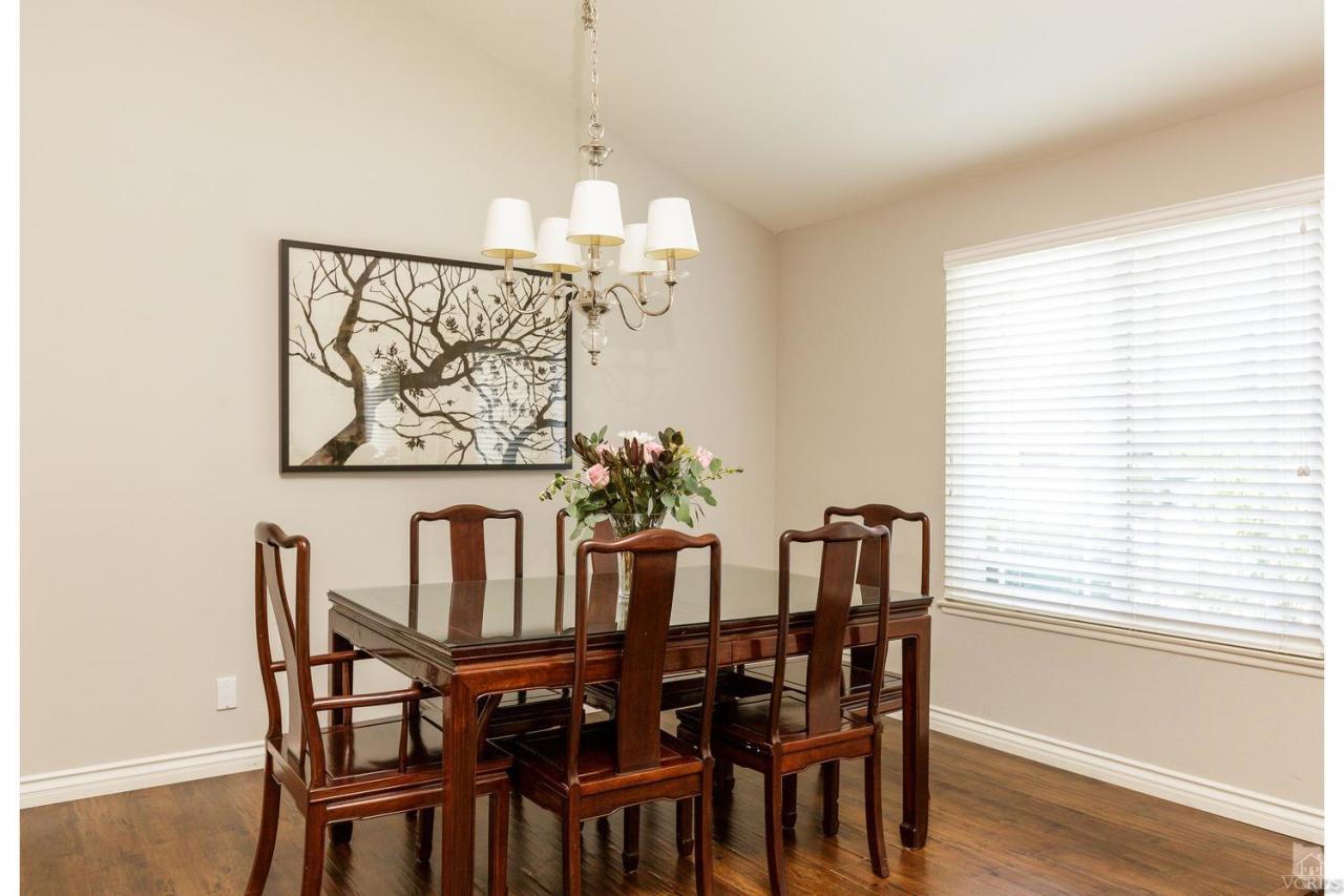 5534 Parkmor Road Calabasas, CA 91302 - Photo 14 of 29 a view of a dining room with furniture window and wooden floor