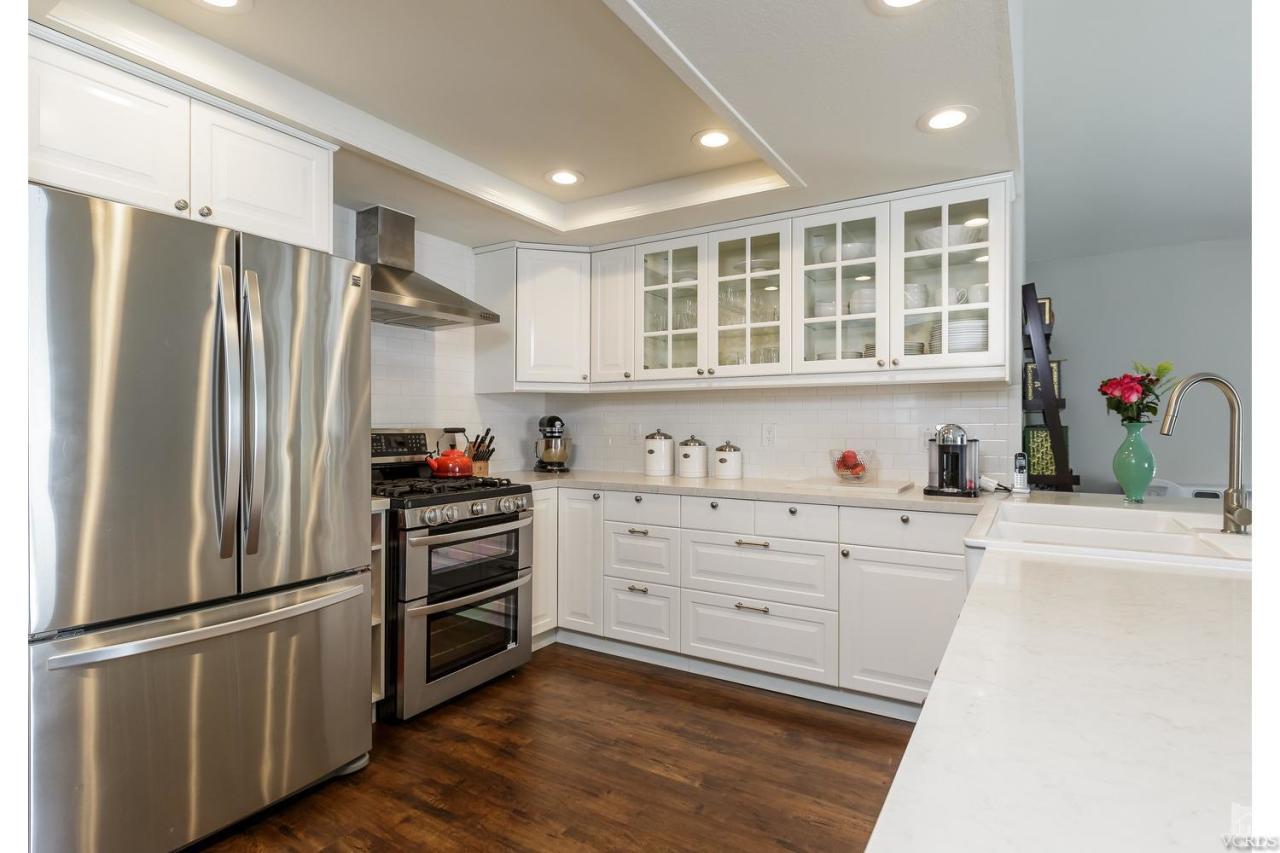 5534 Parkmor Road Calabasas, CA 91302 - Photo 3 of 29 a kitchen with cabinets stainless steel appliances and a window