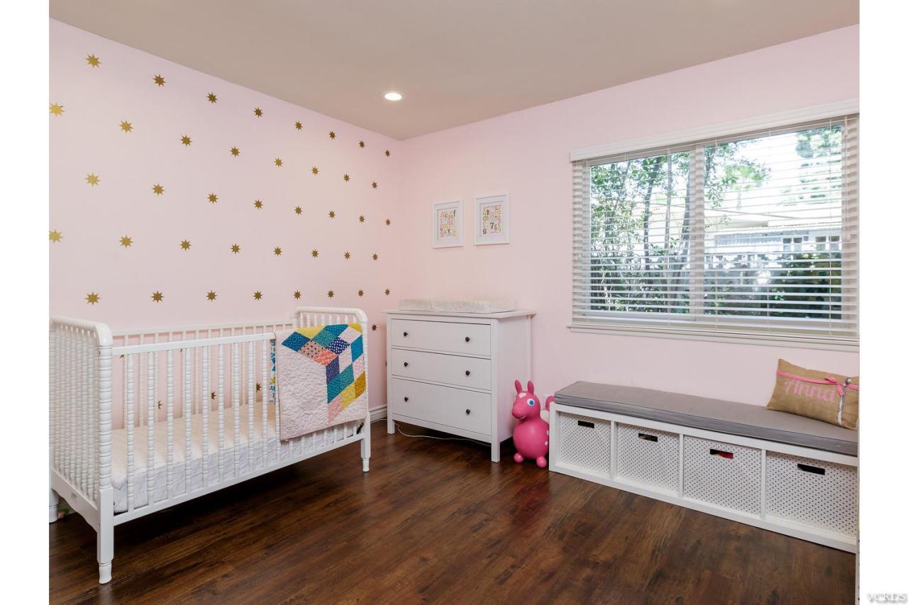 5534 Parkmor Road Calabasas, CA 91302 - Photo 22 of 29 a storage room with furniture and a wooden floor