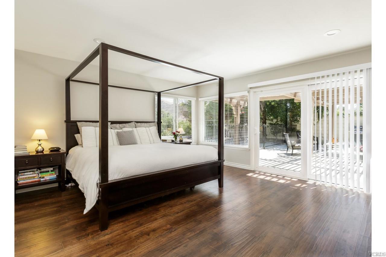 5534 Parkmor Road Calabasas, CA 91302 - Photo 4 of 29 a large white bed sitting in a bedroom next to a window
