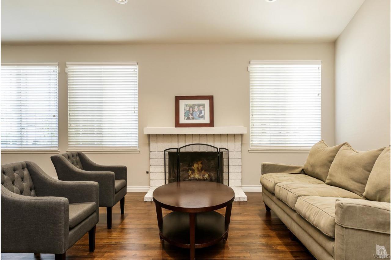 5534 Parkmor Road Calabasas, CA 91302 - Photo 7 of 29 a living room with furniture and a fireplace
