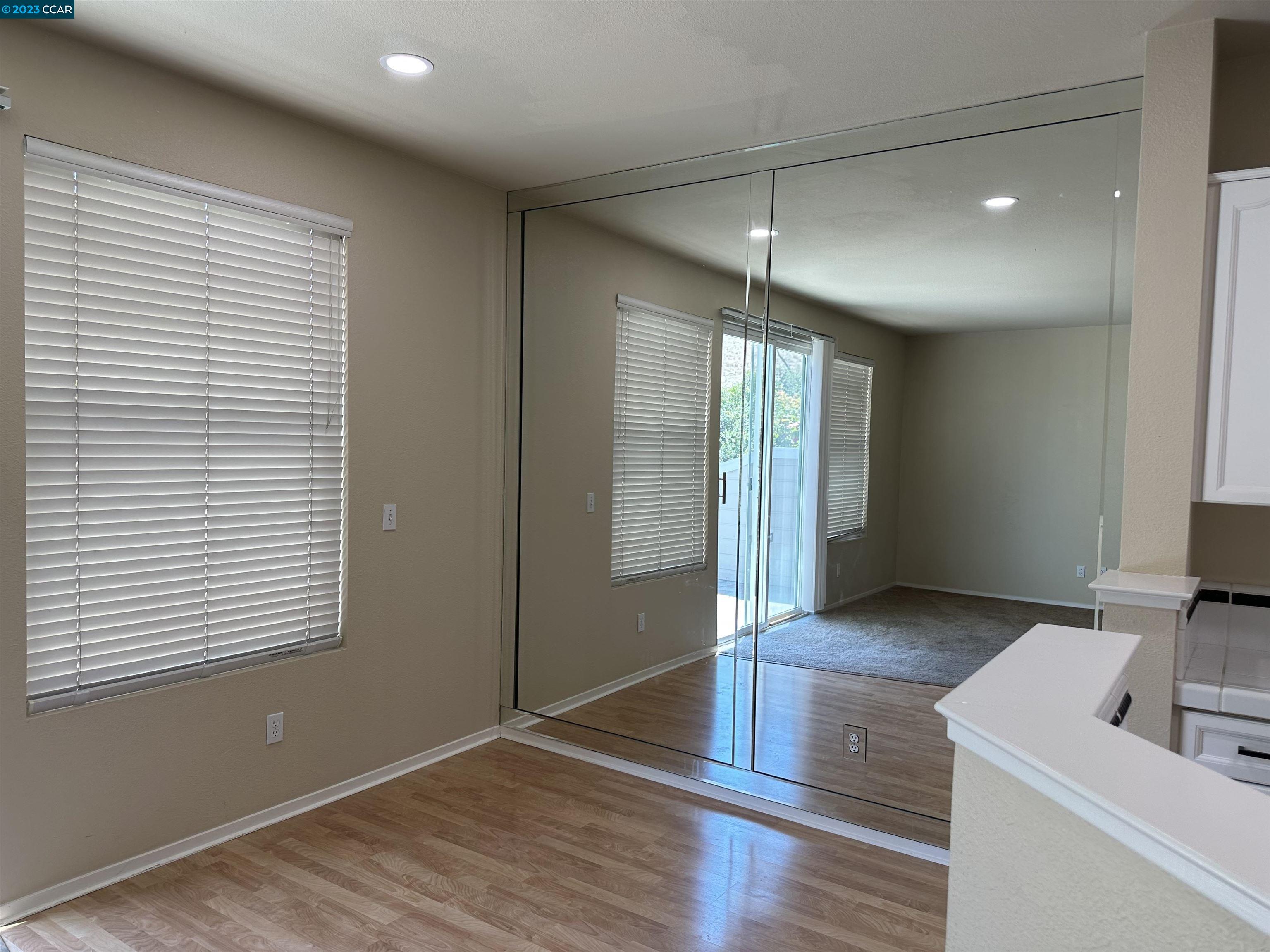 3505 Coyote Circle Clayton, CA 94517 - Photo 4 of 16 a view of a room with wooden floor and a window