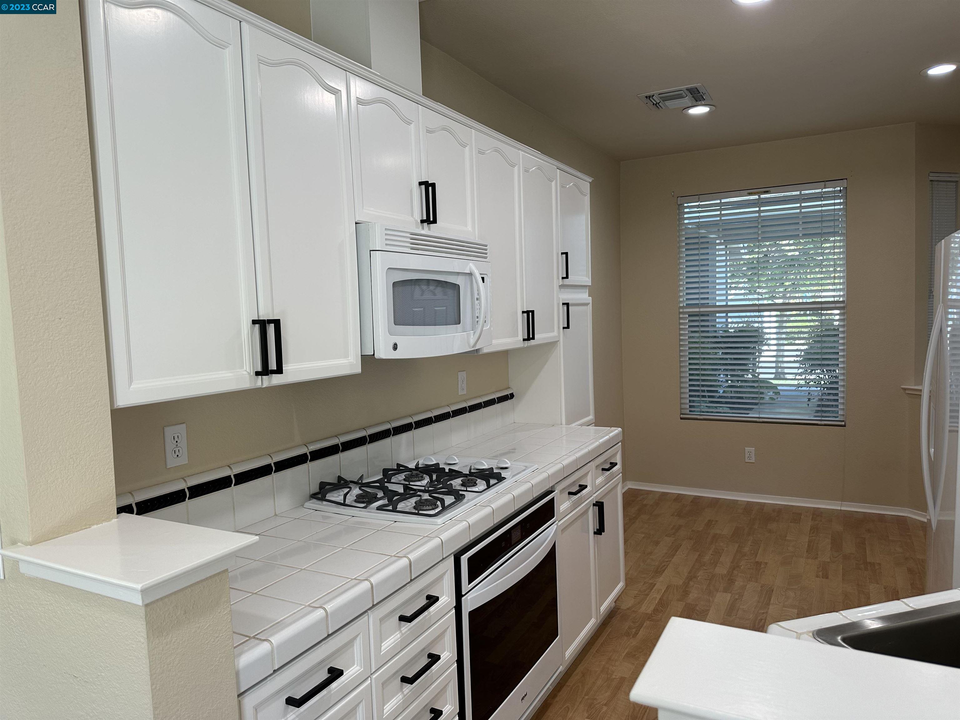 3505 Coyote Circle Clayton, CA 94517 - Photo 5 of 16 a kitchen with a stove and a sink