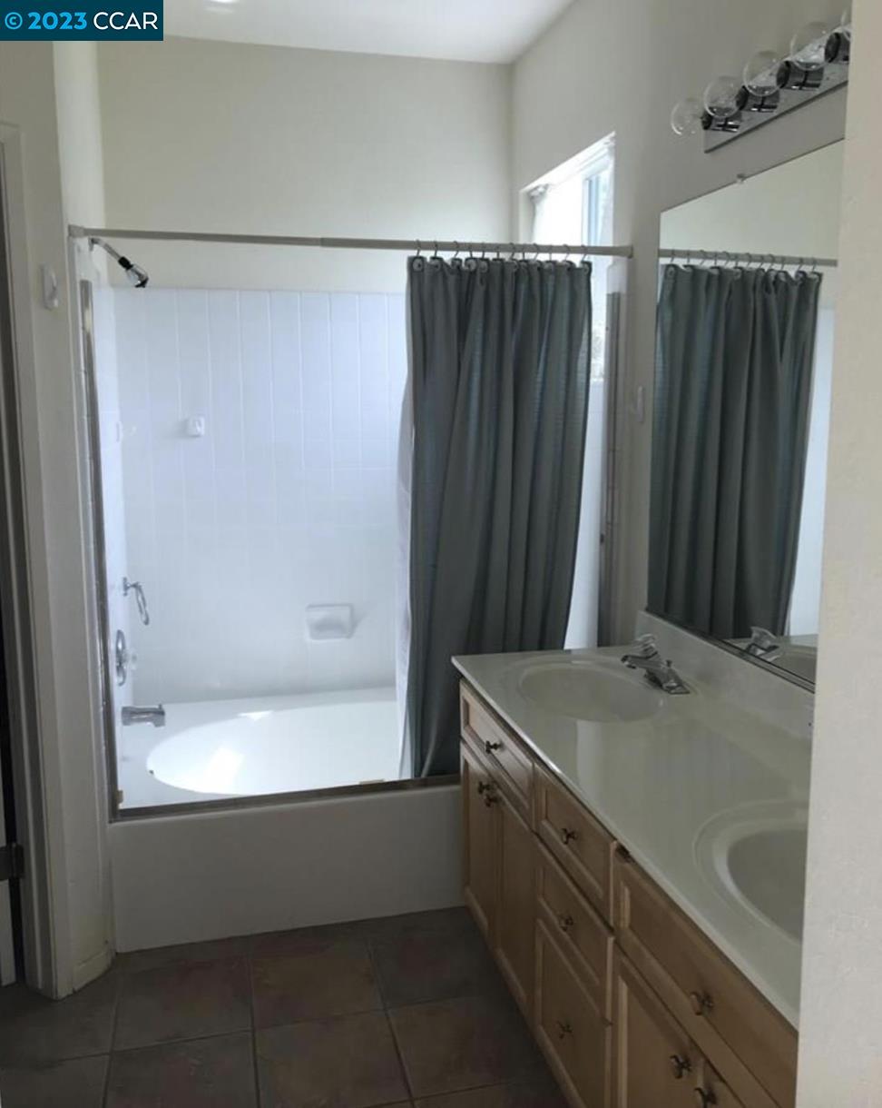 3505 Coyote Circle Clayton, CA 94517 - Photo 9 of 16 a bathroom with a shower and a sink