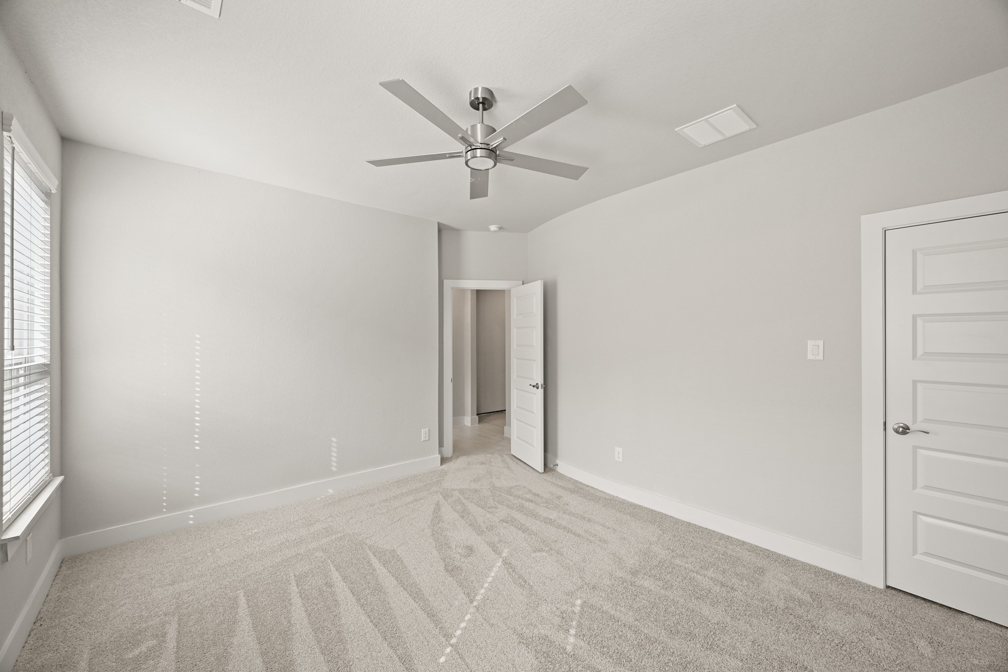 3308 Pin Cherry Lane Conroe, TX 77301 - Photo 11 of 45 an empty room with closet and windows