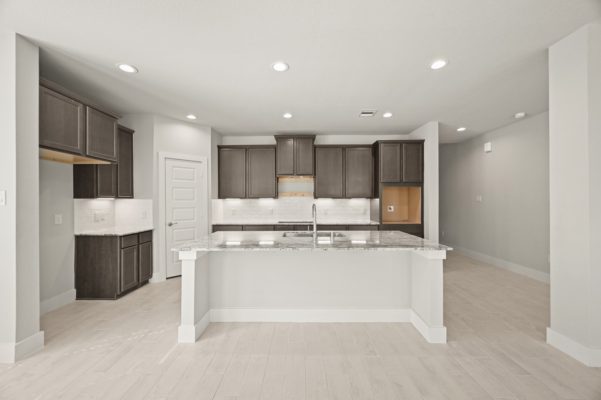 3308 Pin Cherry Lane Conroe, TX 77301 - Photo 2 of 45 a kitchen with stainless steel appliances granite countertop a stove a refrigerator and a refrigerator