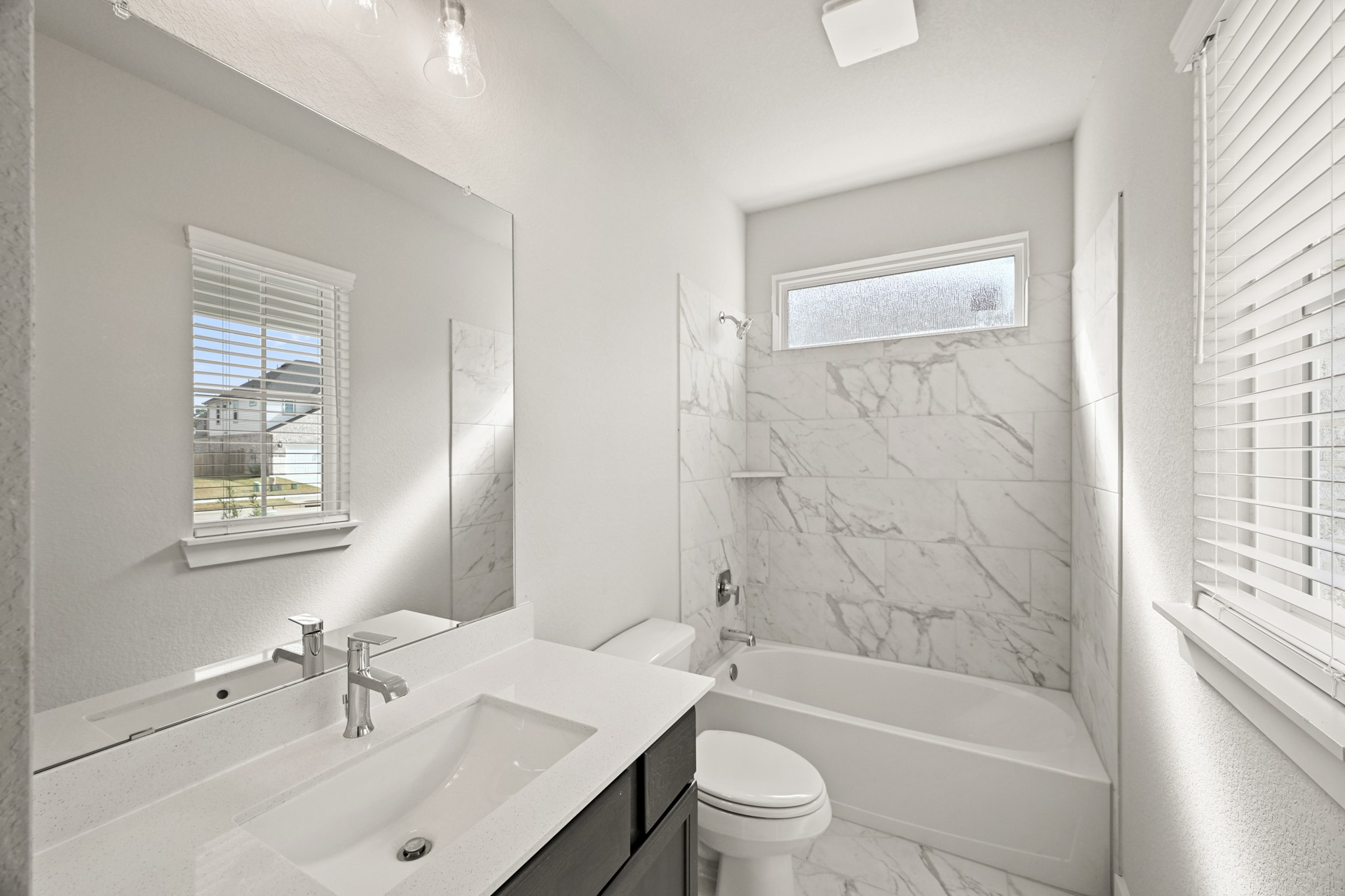 3308 Pin Cherry Lane Conroe, TX 77301 - Photo 22 of 45 a bathroom with a sink toilet tub and shower