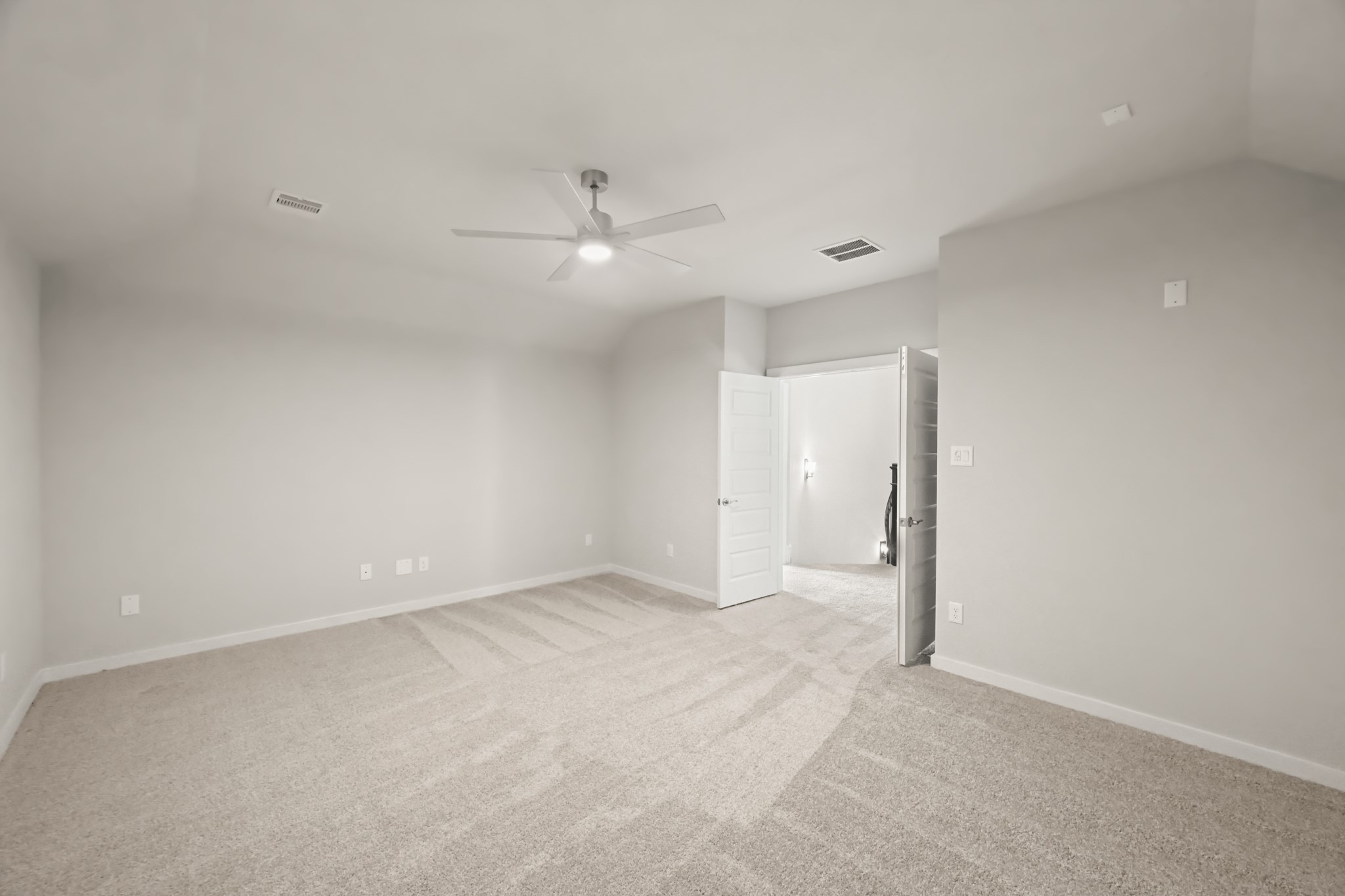 3308 Pin Cherry Lane Conroe, TX 77301 - Photo 27 of 45 an empty room with a ceiling fan and a bathroom