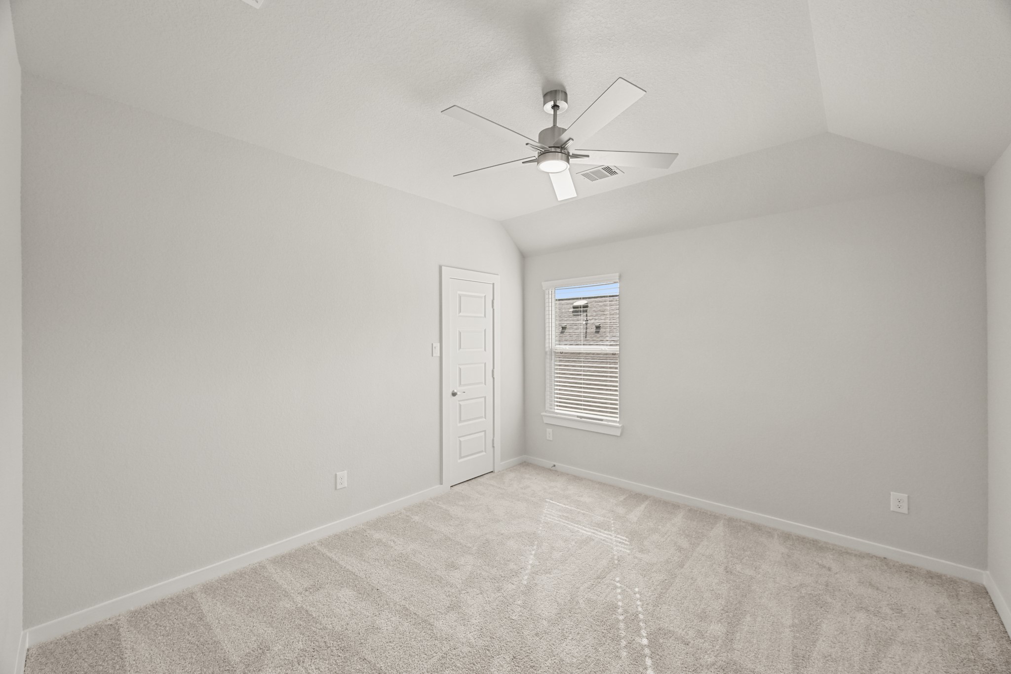 3308 Pin Cherry Lane Conroe, TX 77301 - Photo 33 of 45 an empty room with windows and fan