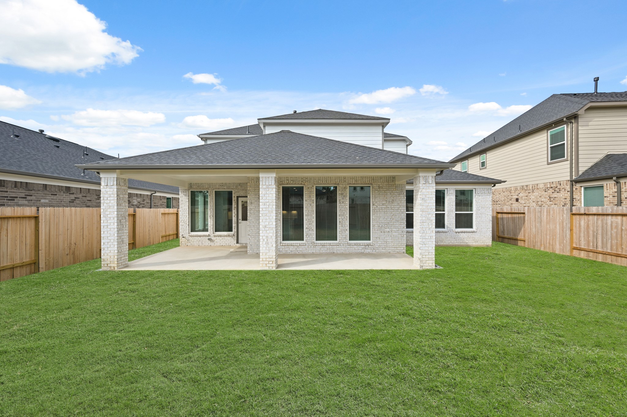 3308 Pin Cherry Lane Conroe, TX 77301 - Photo 38 of 45 a front view of a house with a garden and yard