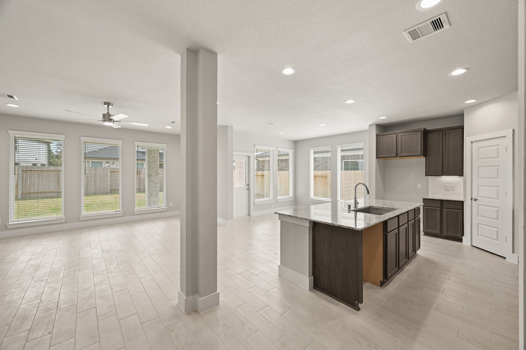 3308 Pin Cherry Lane Conroe, TX 77301 - Photo 6 of 45 a kitchen with stainless steel appliances granite countertop a stove and a sink