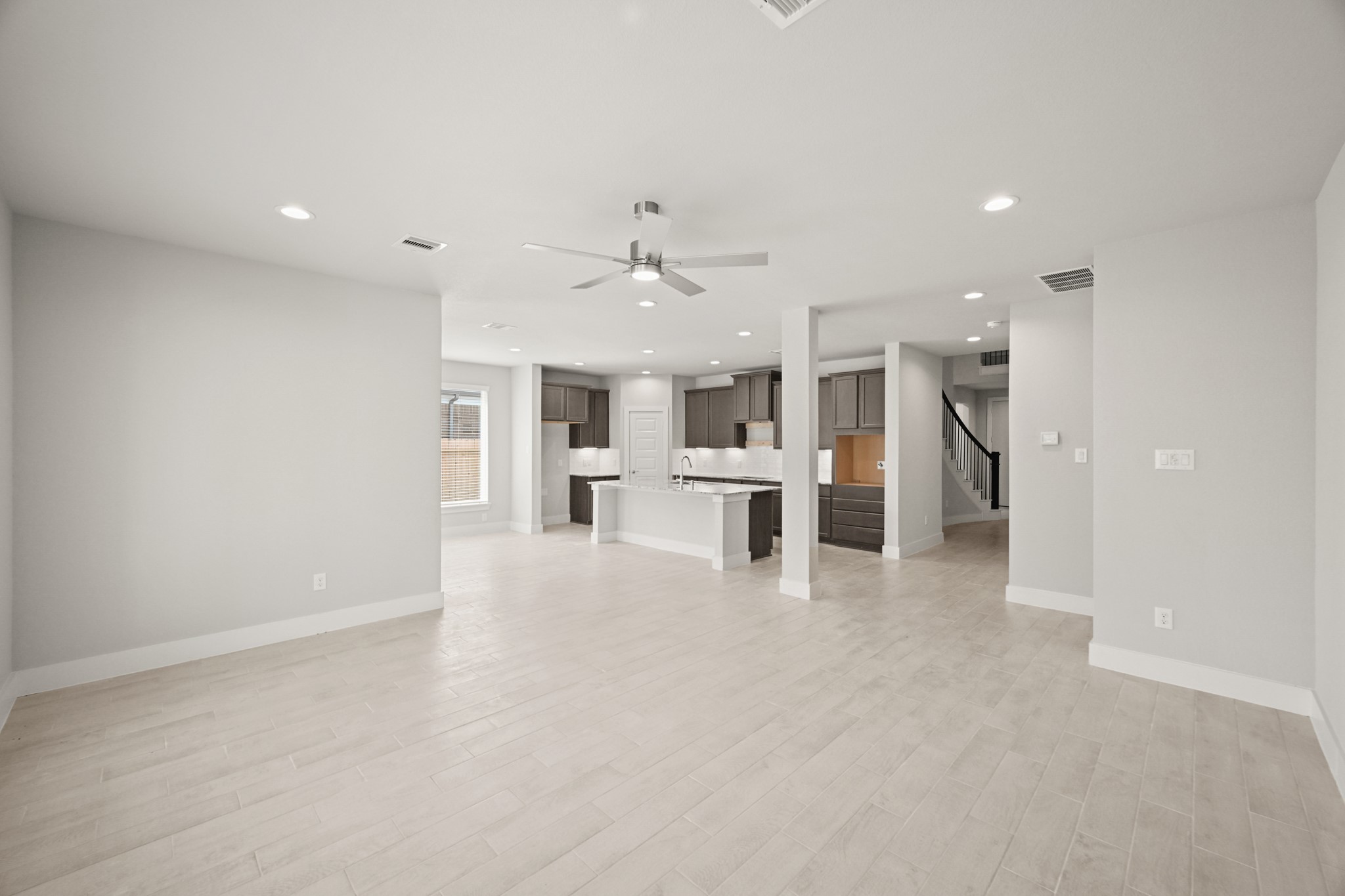3308 Pin Cherry Lane Conroe, TX 77301 - Photo 10 of 45 a view of kitchen with refrigerator stove and a fireplace