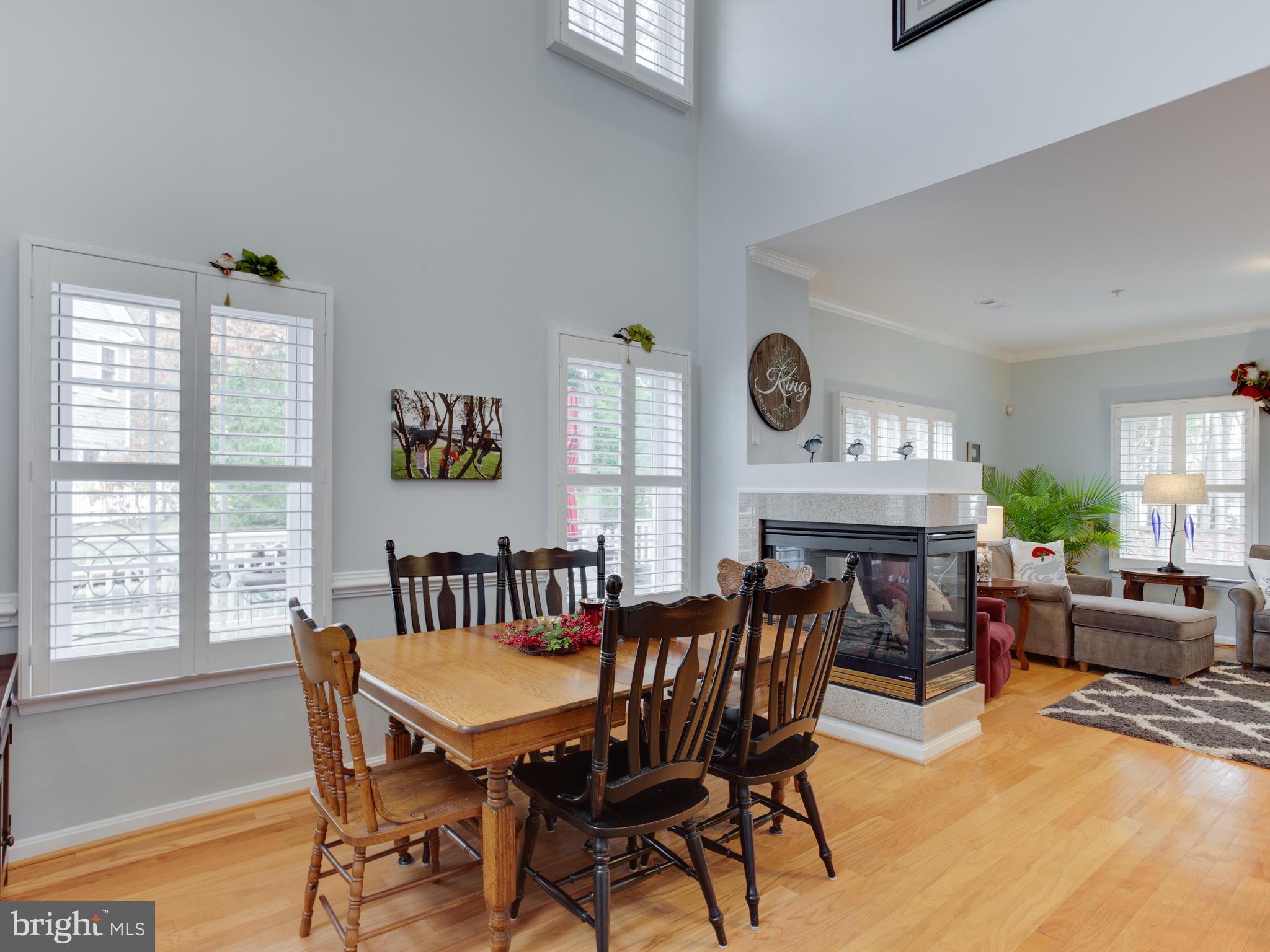 700 Ruxton Road, Unit 71 Solomons, MD 20629 - Photo 12 of 66 2 story ceiling, dining, fireplace, hardwoods