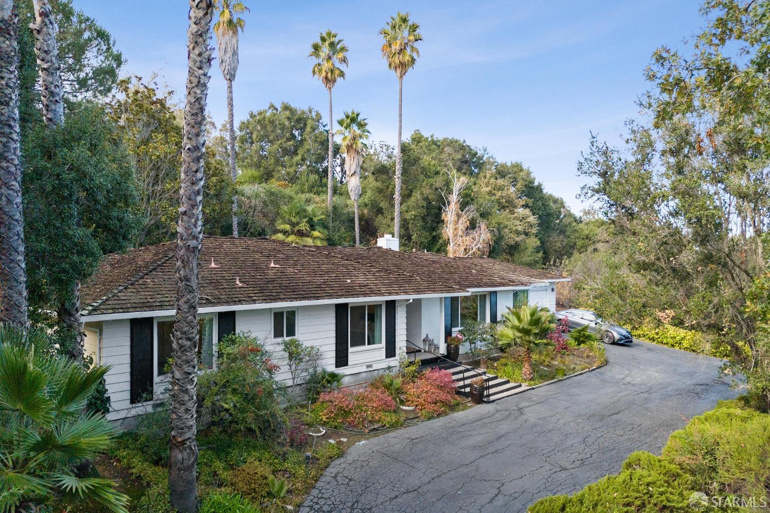 57 Ridge View Drive Atherton, CA 94027 - Photo 1 of 33 a view of a house with a yard and a garden