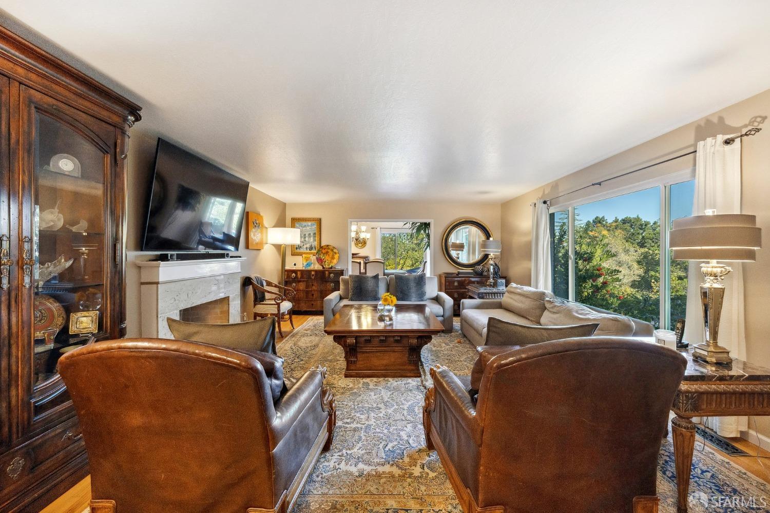 57 Ridge View Drive Atherton, CA 94027 - Photo 12 of 33 a living room with fireplace furniture and a flat screen tv