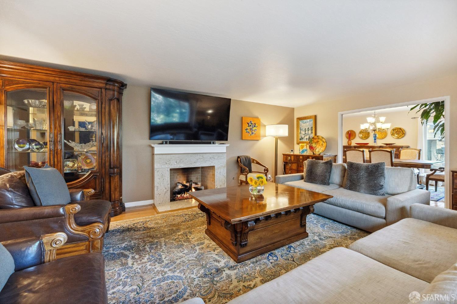 57 Ridge View Drive Atherton, CA 94027 - Photo 14 of 33 a living room with furniture a flat screen tv and a fireplace