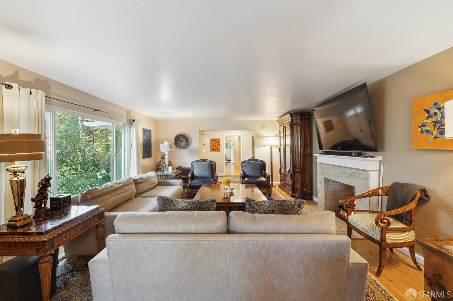 57 Ridge View Drive Atherton, CA 94027 - Photo 15 of 33 a living room with furniture and a flat screen tv