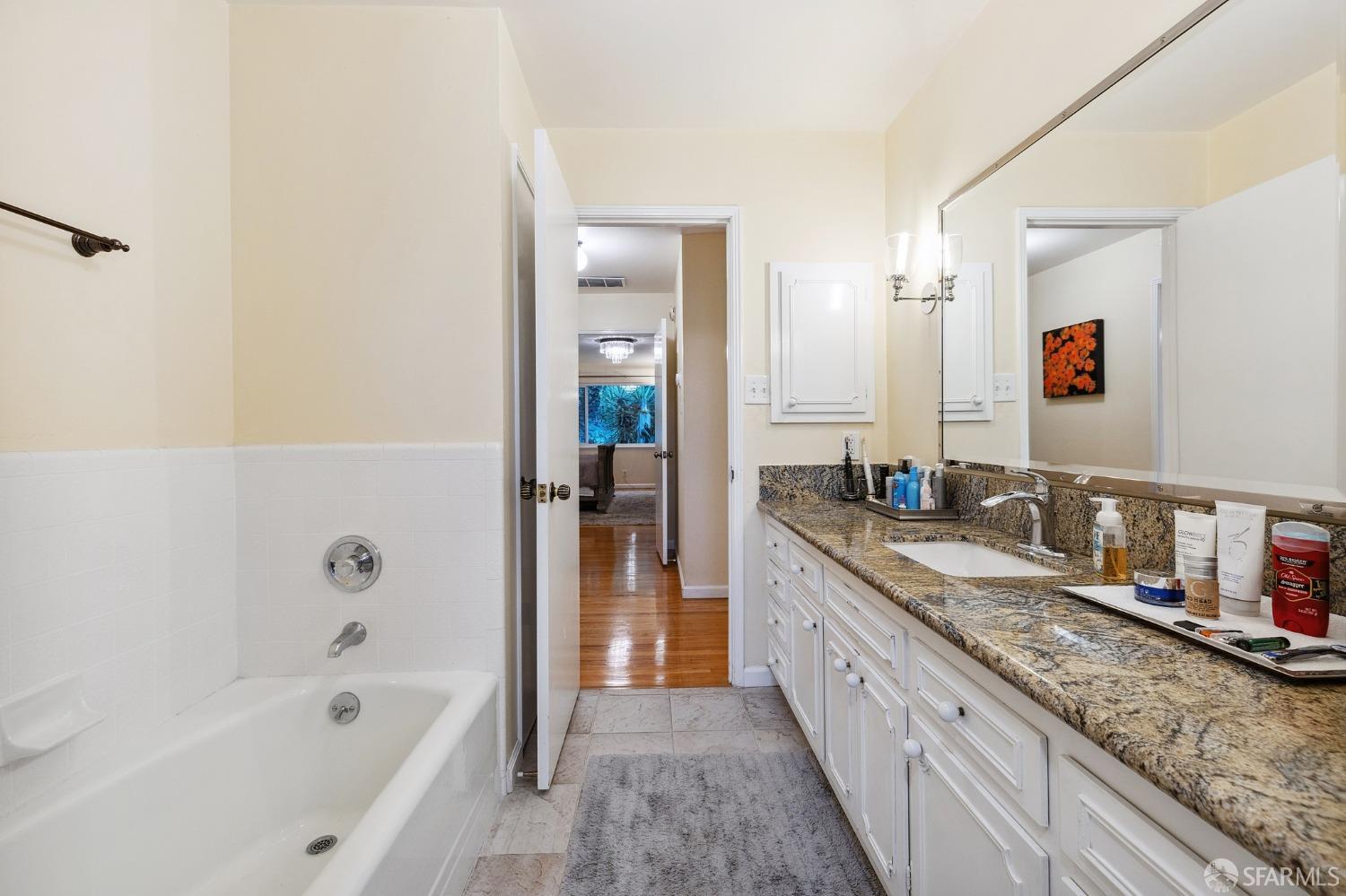 57 Ridge View Drive Atherton, CA 94027 - Photo 20 of 33 a bathroom with a granite countertop tub sink and mirror