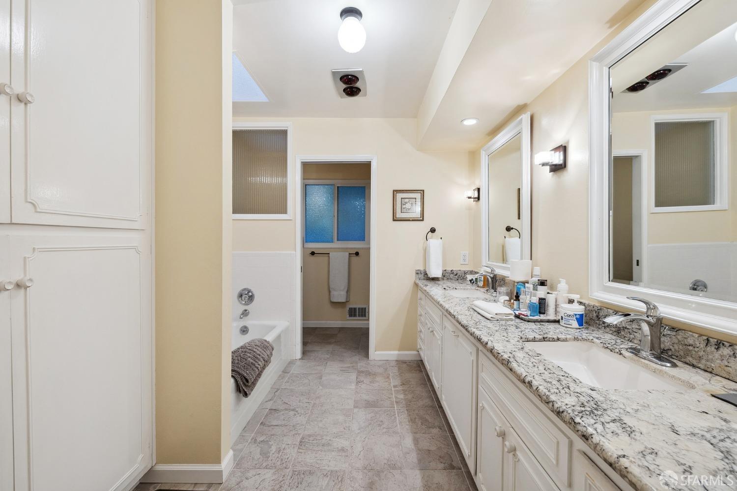 57 Ridge View Drive Atherton, CA 94027 - Photo 23 of 33 a bathroom with a granite countertop sink a mirror and a shower