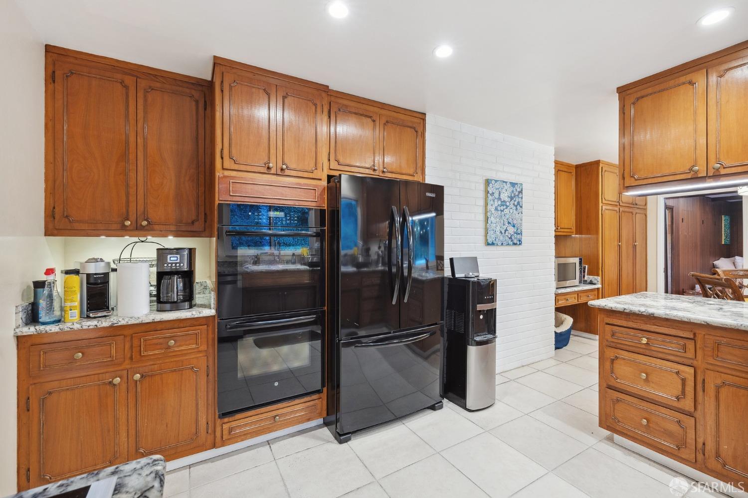 57 Ridge View Drive Atherton, CA 94027 - Photo 29 of 33 a kitchen with granite countertop stainless steel appliances and wooden cabinets