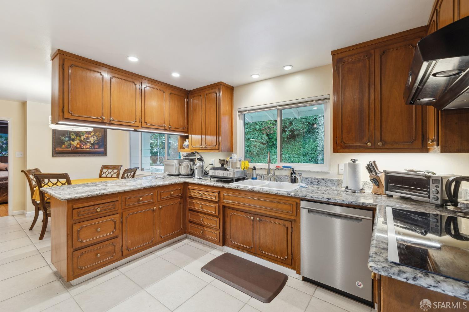 57 Ridge View Drive Atherton, CA 94027 - Photo 30 of 33 a kitchen with a sink stove and cabinets