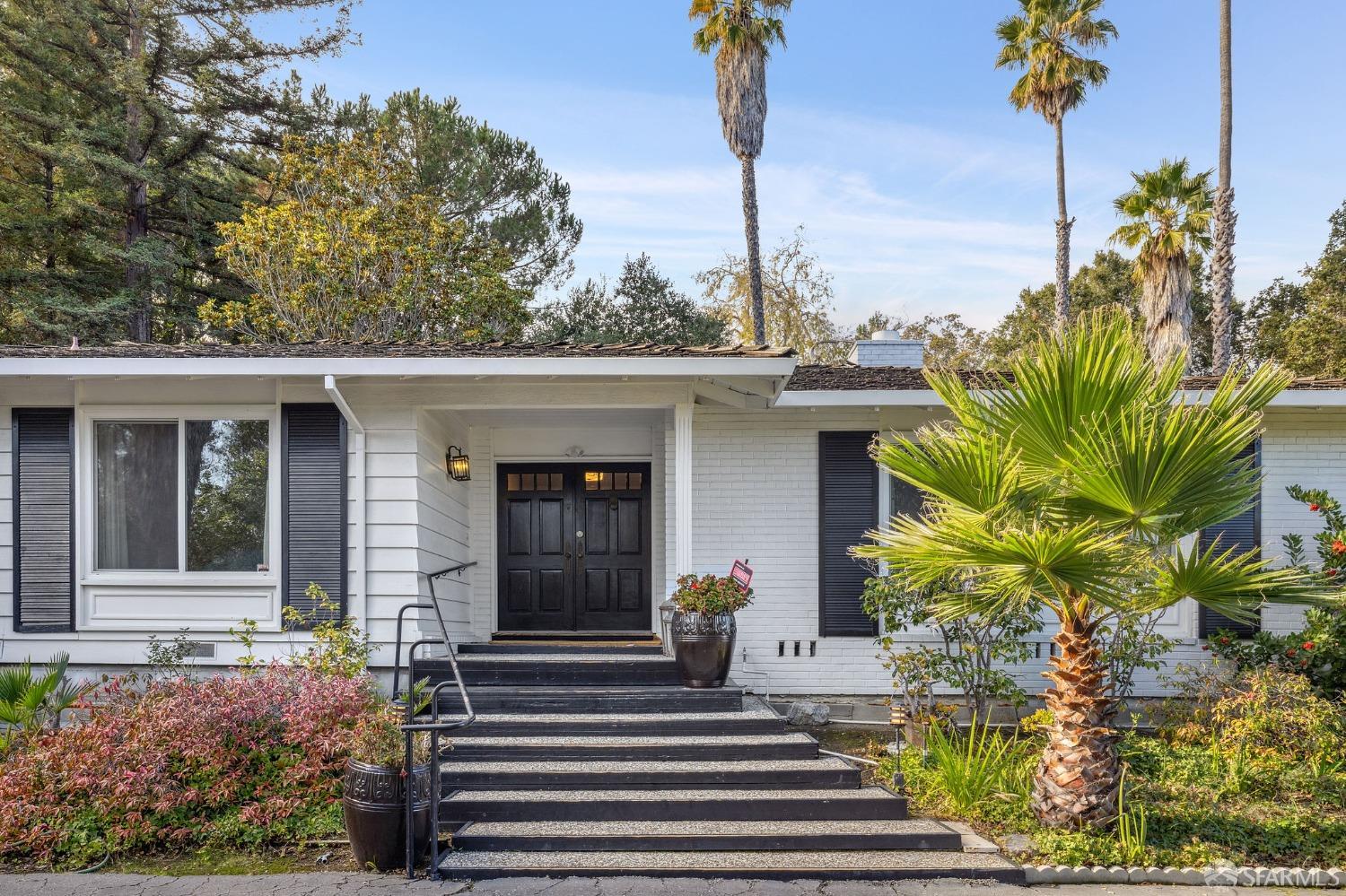57 Ridge View Drive Atherton, CA 94027 - Photo 9 of 33 a front view of a house with a garden