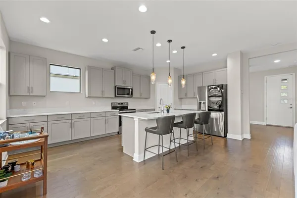 a kitchen with a sink cabinets and window