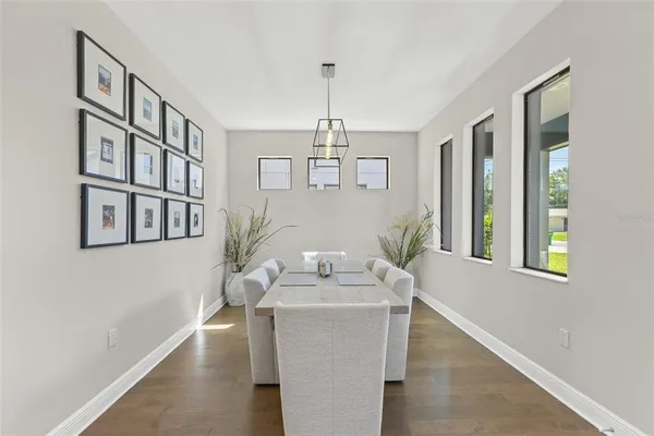 a dining room with furniture and window