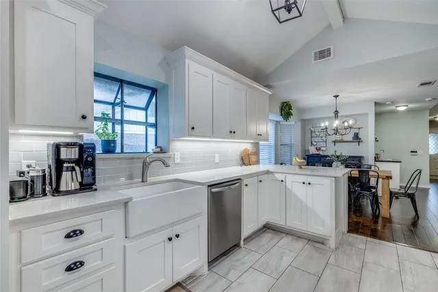 a kitchen with a sink and cabinets