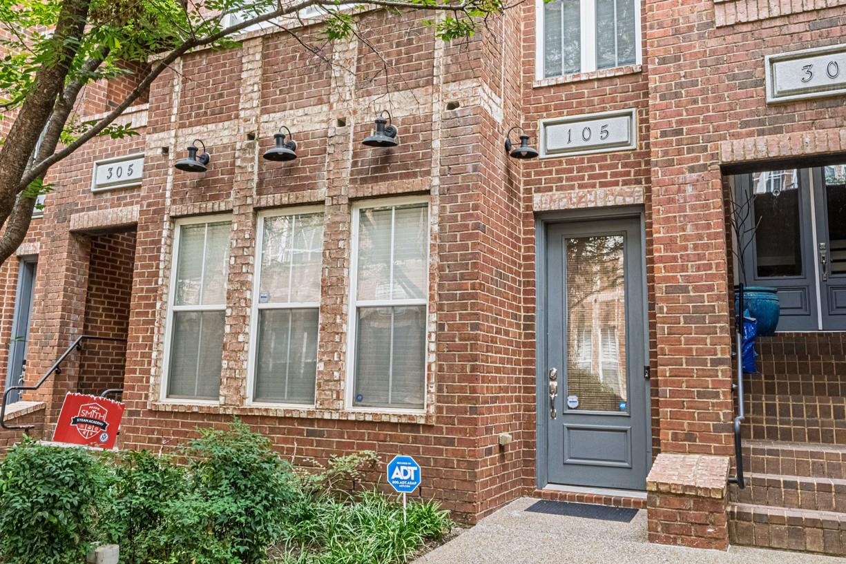 75 Shoemaker Court, Unit 105 Memphis, TN 38103 - Photo 1 of 25 a front view of a multi story residential apartment building