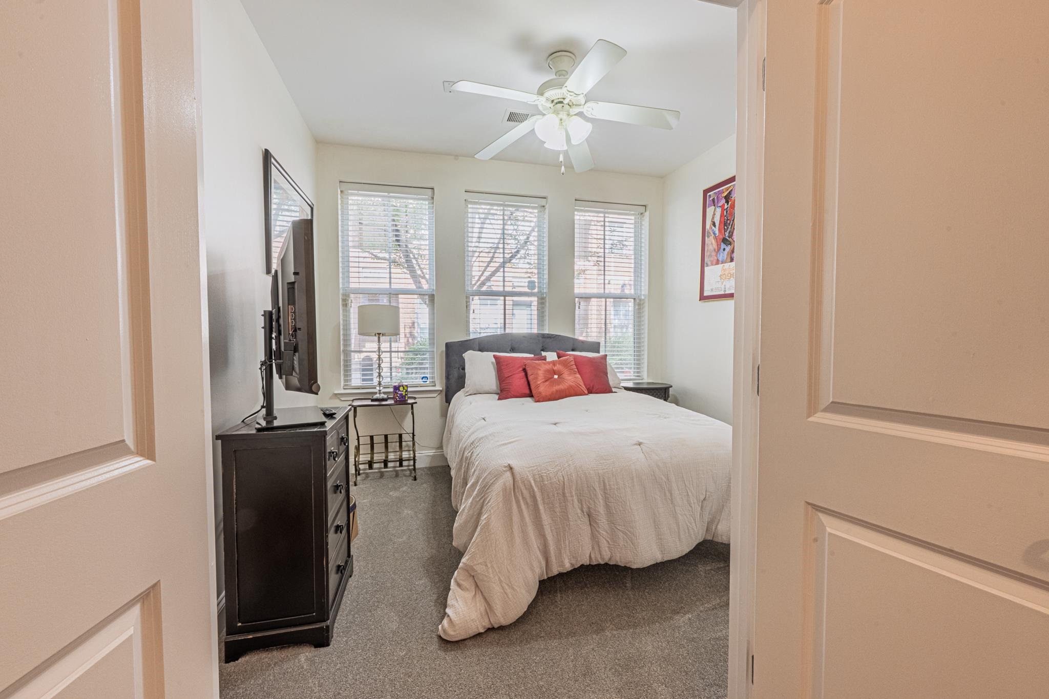 75 Shoemaker Court, Unit 105 Memphis, TN 38103 - Photo 14 of 25 a bedroom with a bed and a chandelier