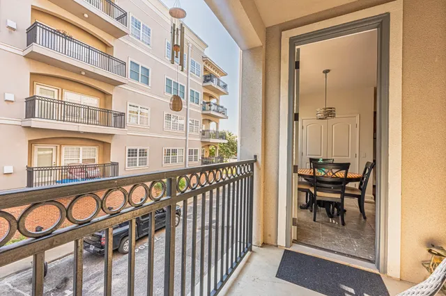 a view of a chair and table in the balcony