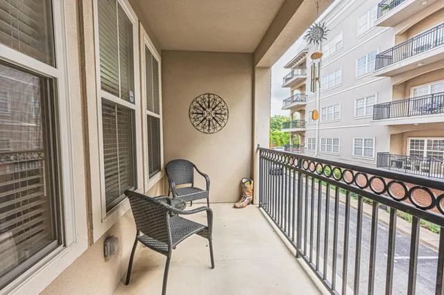 a couple of table and chairs in front of building