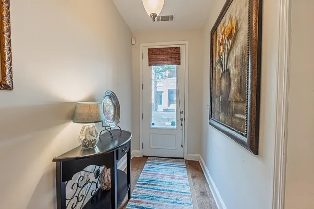 a view of front door with wooden floor