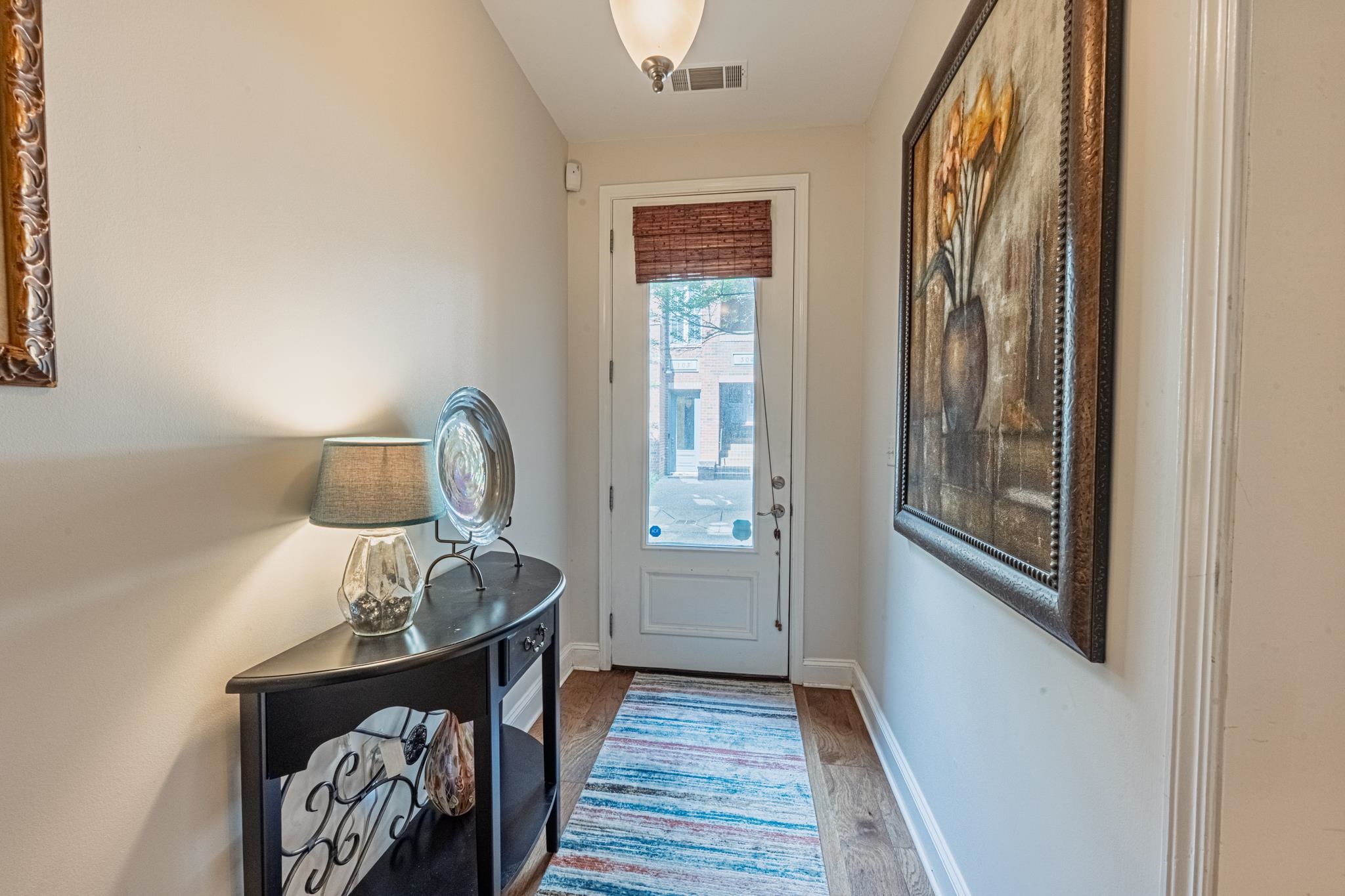 75 Shoemaker Court, Unit 105 Memphis, TN 38103 - Photo 2 of 25 a view of front door with wooden floor